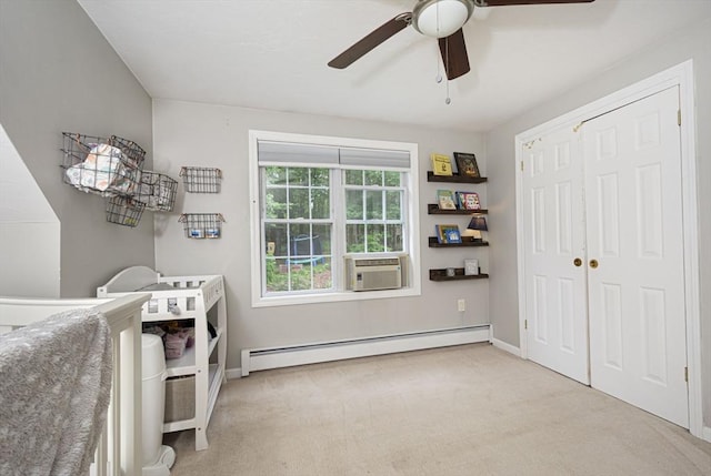 54 Clarke Rd, Sturbridge, MA 01518 - laundry area with baseboard heating, a ceiling fan, carpet flooring, and cooling unit