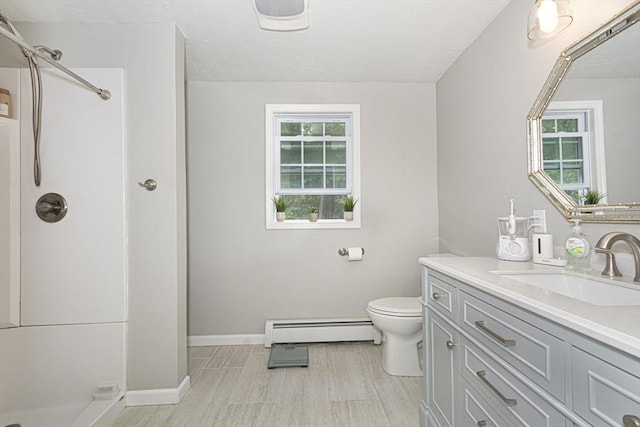 54 Clarke Rd, Sturbridge, MA 01518 - full bath featuring a baseboard radiator, a shower, vanity, and wood finished floors