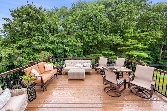 wooden terrace featuring an outdoor living space