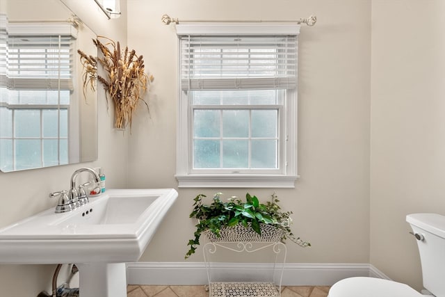 bathroom featuring tile patterned floors, sink, and toilet