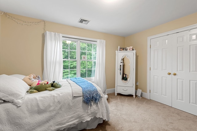 carpeted bedroom with a closet