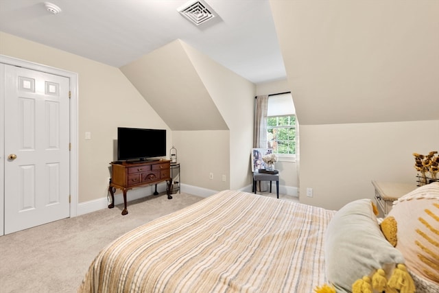 carpeted bedroom with vaulted ceiling