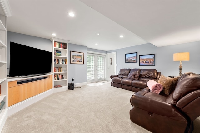 living room featuring light carpet and french doors