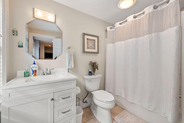 full bathroom featuring tile patterned flooring, shower / tub combo, vanity, and toilet