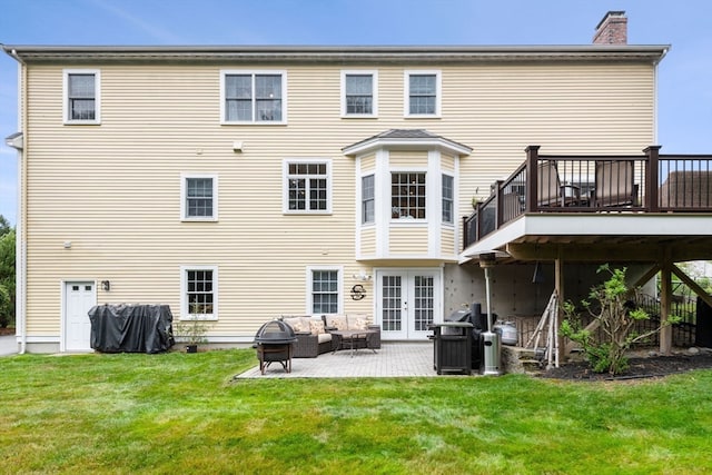 back of house featuring a yard, a patio area, french doors, and a deck