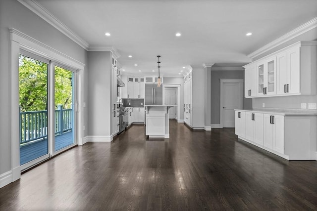 1 Farwell Cir, Newton, MA 02460 - unfurnished living room featuring dark wood-style flooring, baseboards, recessed lighting, ornamental molding, and a sink