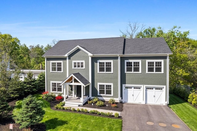 1 Farwell Cir, Newton, MA 02460 - view of front facade with driveway, a front yard, and a shingled roof