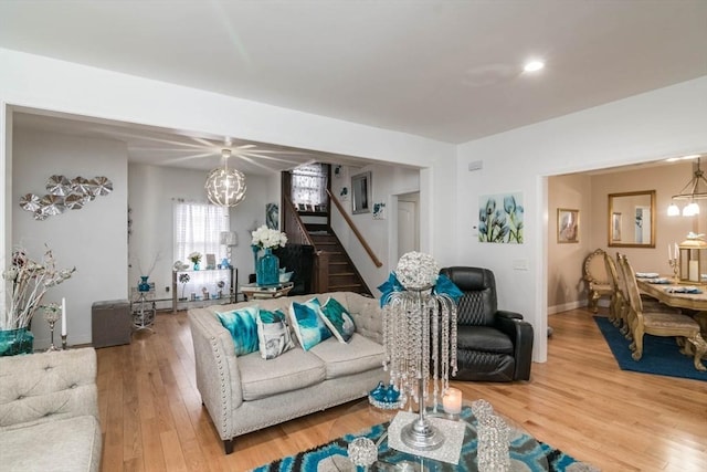 living room featuring hardwood / wood-style flooring and a notable chandelier