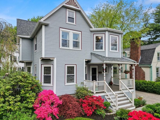 41 Clarke St, Lexington, MA 02421 - victorian house featuring covered porch and a shingled roof