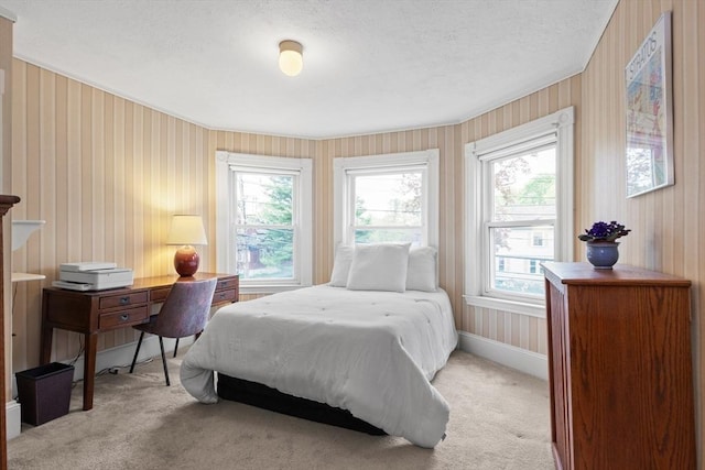 41 Clarke St, Lexington, MA 02421 - bedroom featuring light colored carpet, multiple windows, a textured ceiling, wallpapered walls, and baseboards