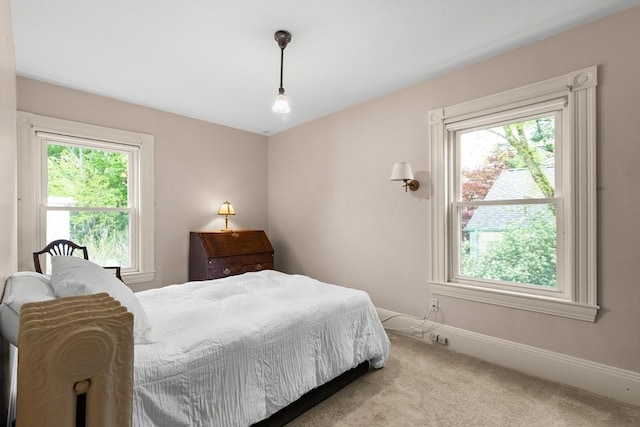 41 Clarke St, Lexington, MA 02421 - carpeted bedroom with multiple windows and baseboards