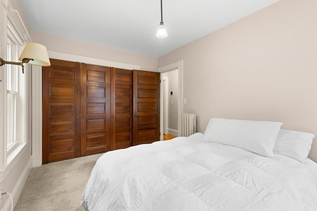 41 Clarke St, Lexington, MA 02421 - bedroom featuring radiator heating unit, a closet, and light colored carpet