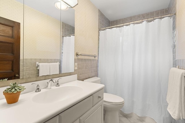 41 Clarke St, Lexington, MA 02421 - bathroom featuring toilet, tile patterned flooring, vanity, curtained shower, and tile walls