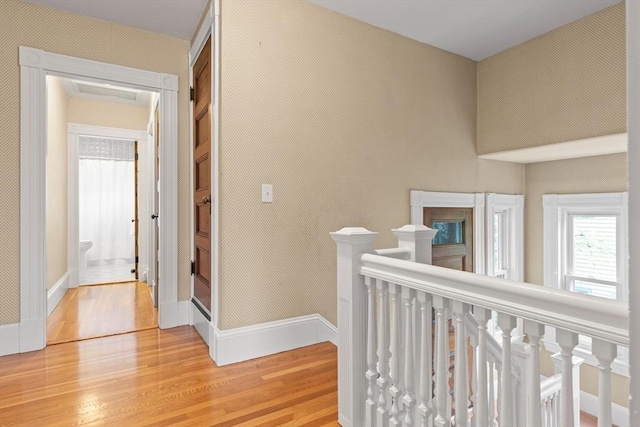 41 Clarke St, Lexington, MA 02421 - hallway with an upstairs landing, light wood finished floors, and baseboards