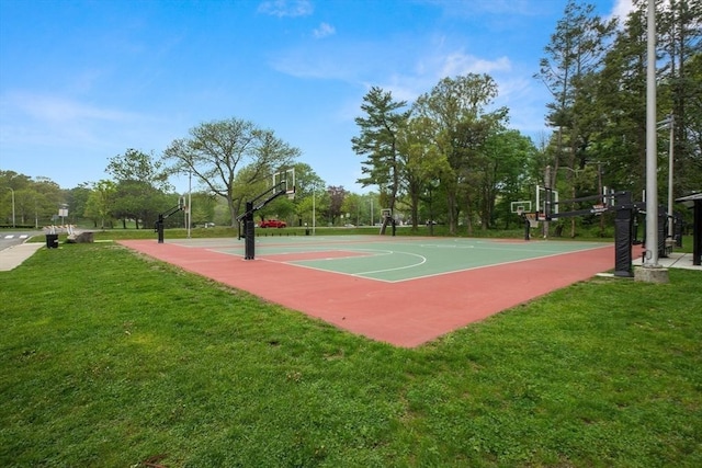 41 Clarke St, Lexington, MA 02421 - view of sport court with community basketball court, a yard, and view of wooded area