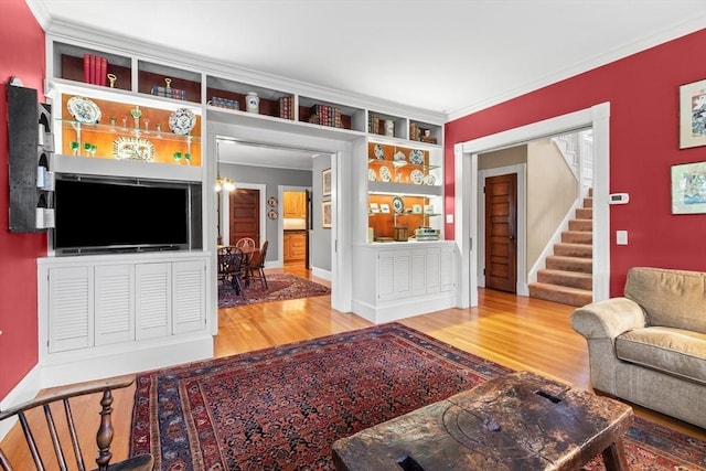 41 Clarke St, Lexington, MA 02421 - living area featuring wood finished floors, stairway, and ornamental molding