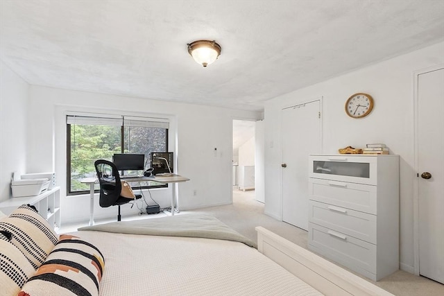 34 Staffordshire Ln Unit 34, Concord, MA 01742 - bedroom with light carpet, baseboards, and an office area
