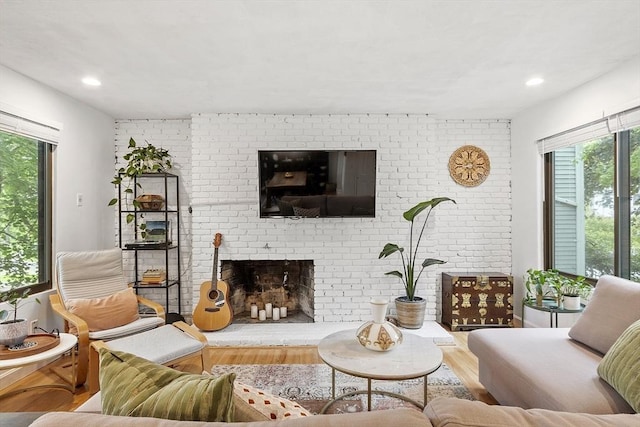34 Staffordshire Ln Unit 34, Concord, MA 01742 - living area with wood finished floors, a fireplace, and recessed lighting