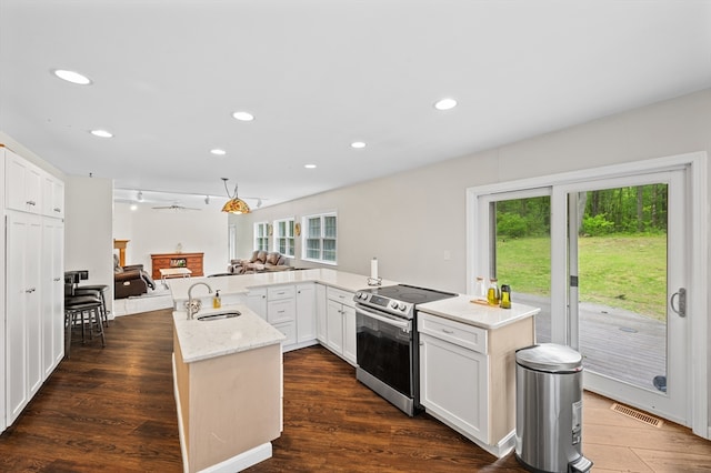 78 Holden Rd, Paxton, MA 01612 - kitchen featuring stainless steel electric stove, a sink, a spacious island, open floor plan, and dark wood-type flooring