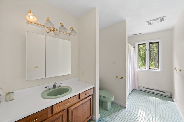 78 Holden Rd, Paxton, MA 01612 - bathroom with a baseboard radiator, vanity, toilet, baseboards, and tile patterned flooring