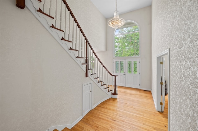 78 Holden Rd, Paxton, MA 01612 - entrance foyer with a chandelier, a high ceiling, hardwood / wood-style flooring, stairs, and a textured wall