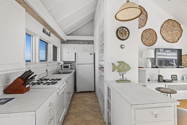 kitchen featuring white cabinets, vaulted ceiling with beams, white appliances, and sink