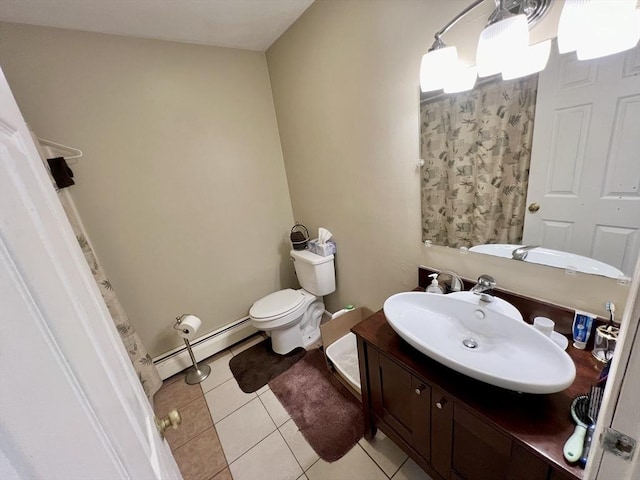 bathroom with tile patterned flooring, vanity, toilet, and baseboard heating