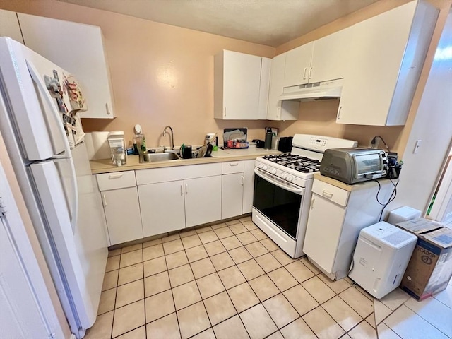 kitchen with white cabinetry, sink, light tile patterned floors, and white appliances