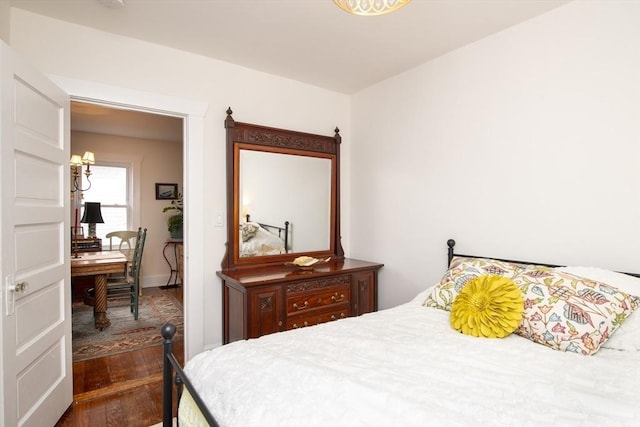 bedroom with wood finished floors