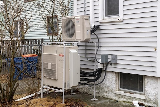 exterior details with ac unit and fence