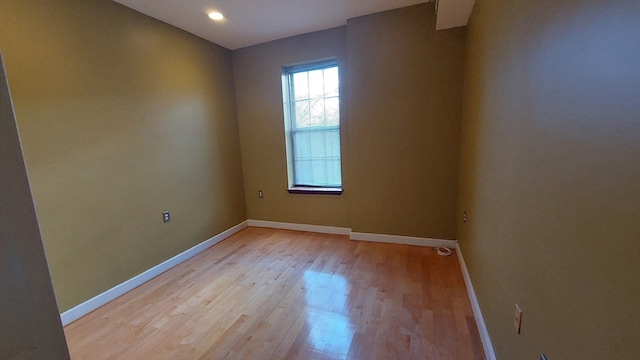 empty room with light hardwood / wood-style floors