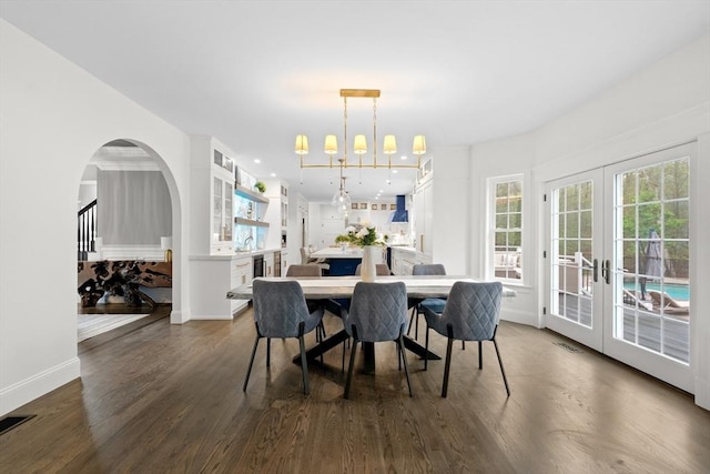 19 Cardiff Rd, Windham, NH 03087 - dining room with dark wood-style flooring, french doors, baseboards, and arched walkways