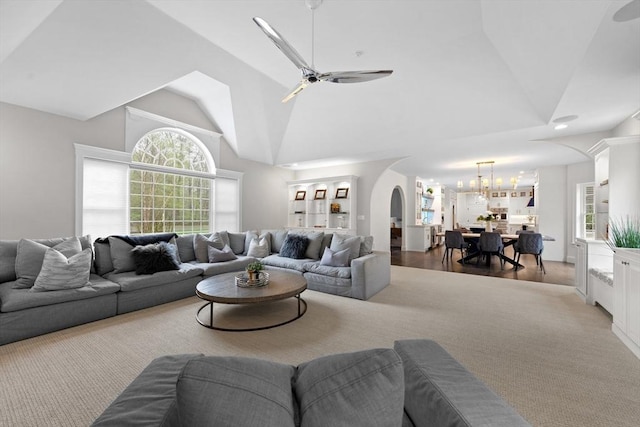 19 Cardiff Rd, Windham, NH 03087 - living room with a chandelier, a ceiling fan, high vaulted ceiling, and arched walkways