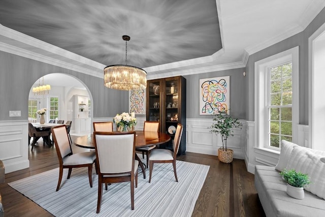 19 Cardiff Rd, Windham, NH 03087 - dining space with a chandelier, arched walkways, wood finished floors, a decorative wall, and a wainscoted wall
