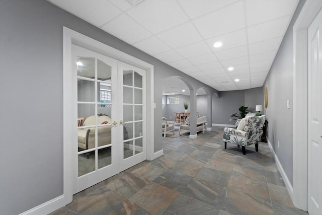 19 Cardiff Rd, Windham, NH 03087 - sitting room featuring arched walkways, french doors, stone finish floors, baseboards, and recessed lighting