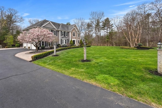 19 Cardiff Rd, Windham, NH 03087 - colonial house with asphalt driveway, a front lawn, and an attached garage