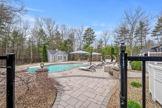 19 Cardiff Rd, Windham, NH 03087 - view of swimming pool featuring a patio area, an exterior structure, and an outdoor structure