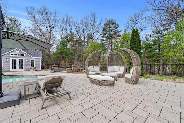 19 Cardiff Rd, Windham, NH 03087 - view of patio with french doors, an exterior structure, and an outbuilding