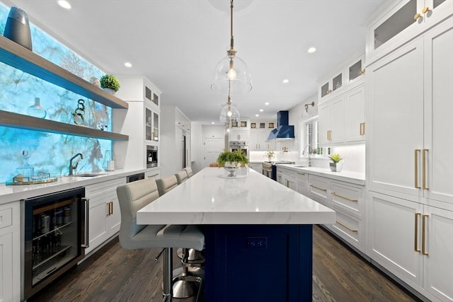 19 Cardiff Rd, Windham, NH 03087 - kitchen with beverage cooler, wall chimney exhaust hood, a sink, stainless steel appliances, and dark wood-style flooring