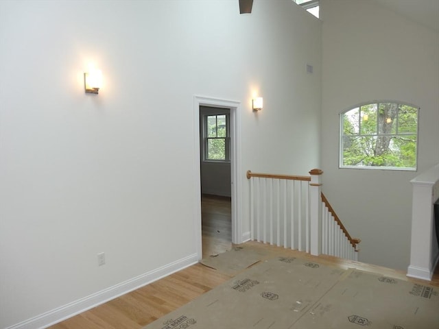 163 Johnson Woods Dr Unit 163, Reading, MA 01867 - unfurnished room with baseboards, a high ceiling, and light wood-style floors