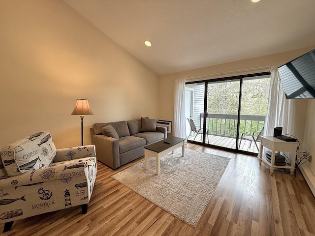 40 Eaton Ln Unit 162, Brewster, MA 02631 - living area featuring light wood finished floors, recessed lighting, and high vaulted ceiling