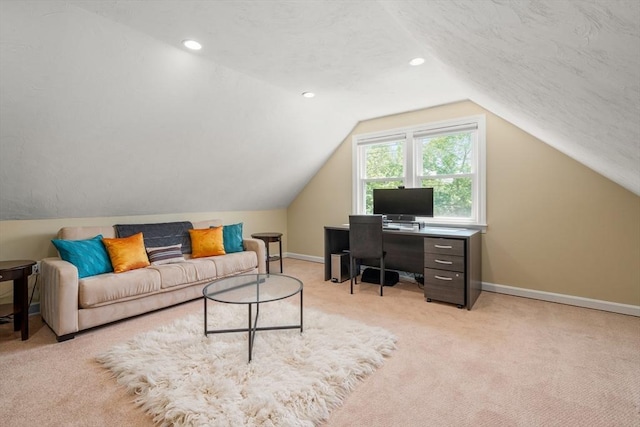office space featuring light colored carpet, baseboards, vaulted ceiling, and recessed lighting