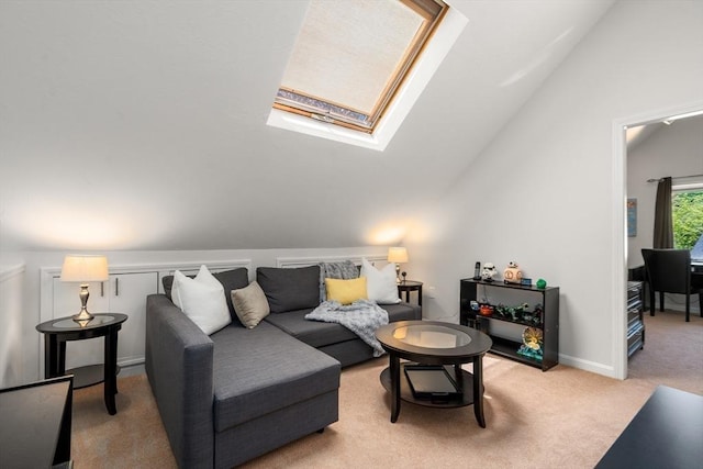 living room featuring lofted ceiling, a skylight, and light carpet