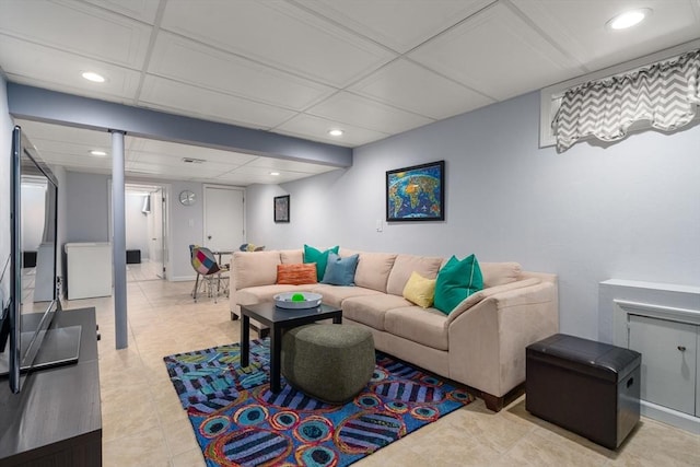 living room with recessed lighting and light tile patterned floors