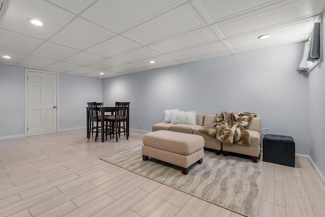 living room featuring recessed lighting, baseboards, and wood finished floors
