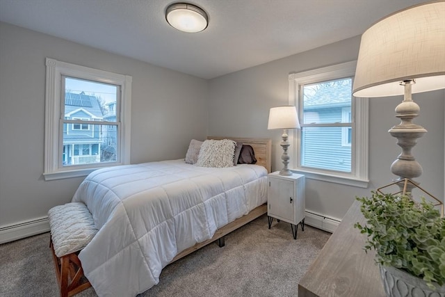 bedroom featuring a baseboard radiator, multiple windows, and light colored carpet