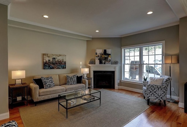 living room featuring wood-type flooring and ornamental molding