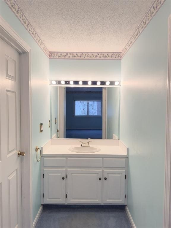 bathroom with vanity and a textured ceiling