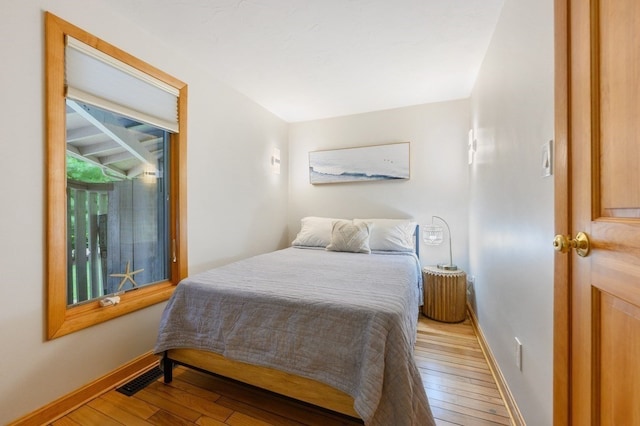 bedroom with light wood-type flooring