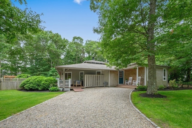 view of front of house with a front lawn and a porch